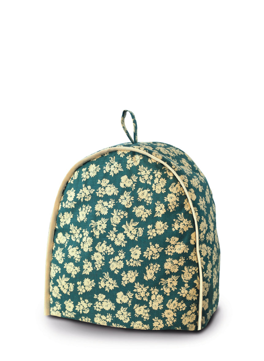 Petit sac de rangement ou housse isotherme à motif floral beige sur fond vert, fermeture à zip et poignée au sommet.
