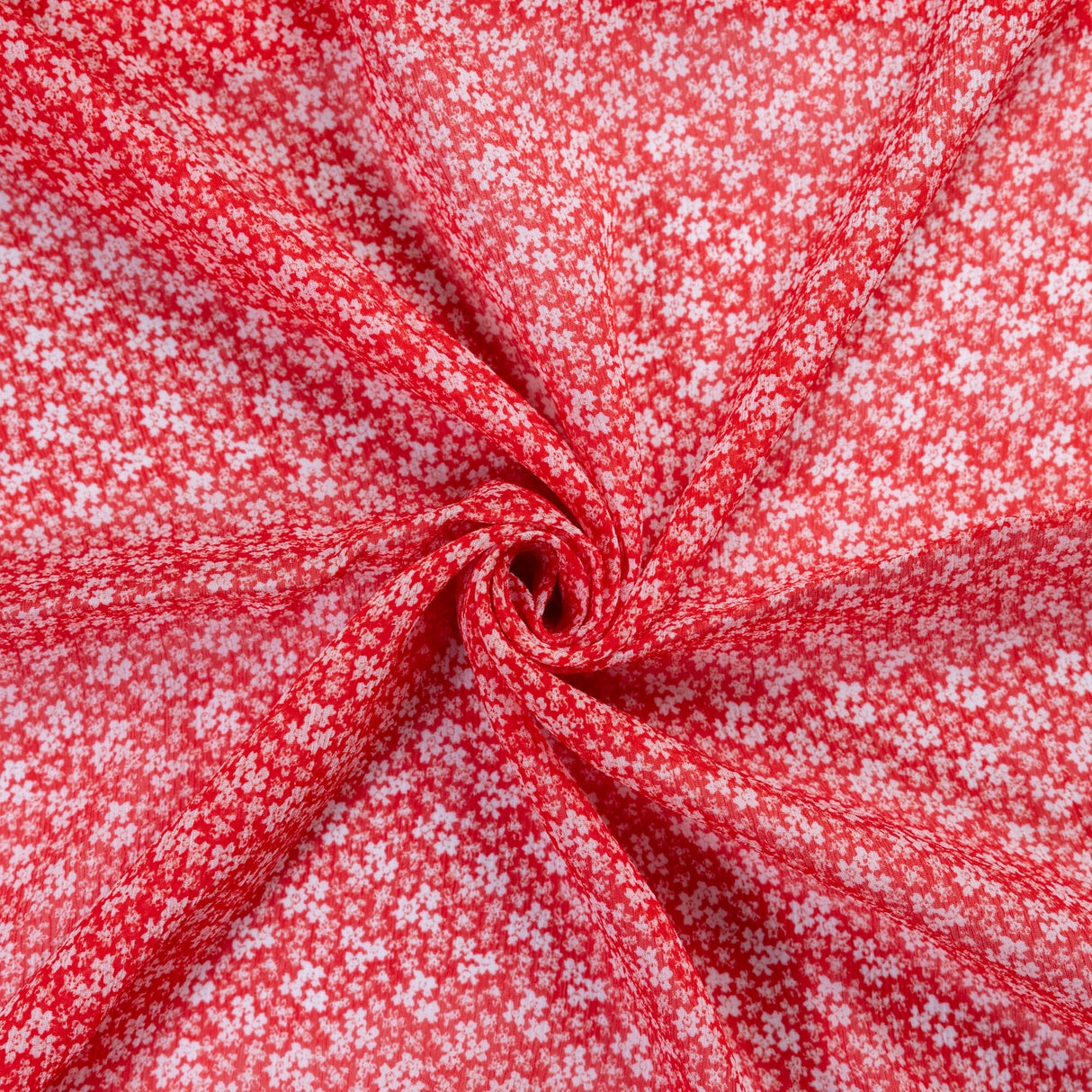 Mousseline 100% viscose – Micro fleurs blanches fond rouge