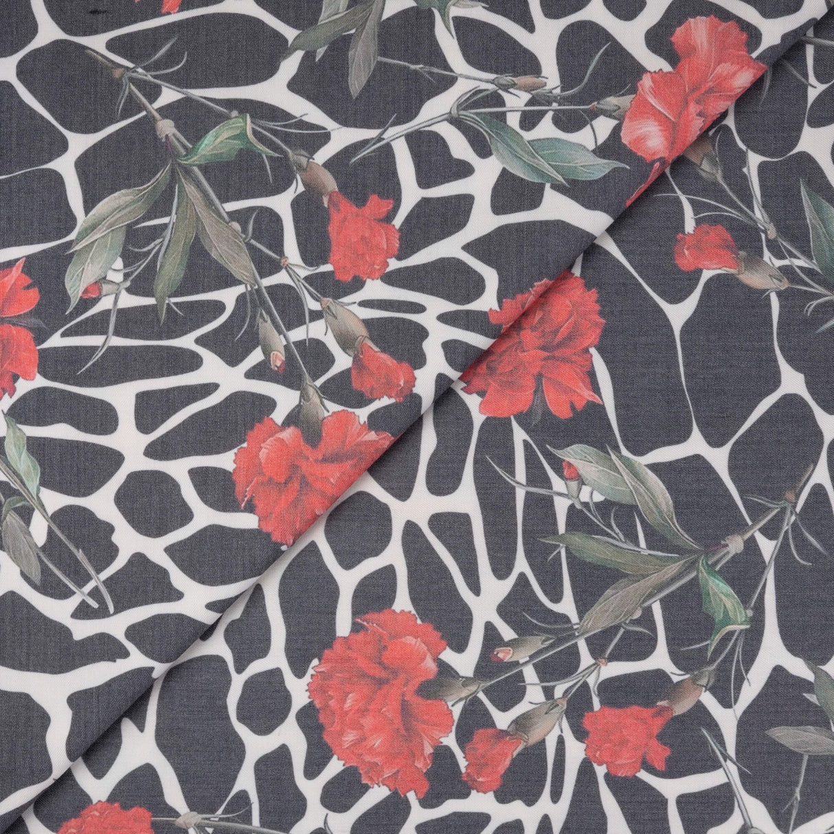 Gabardine de laine extensible - Œillets rouges et graphisme noir