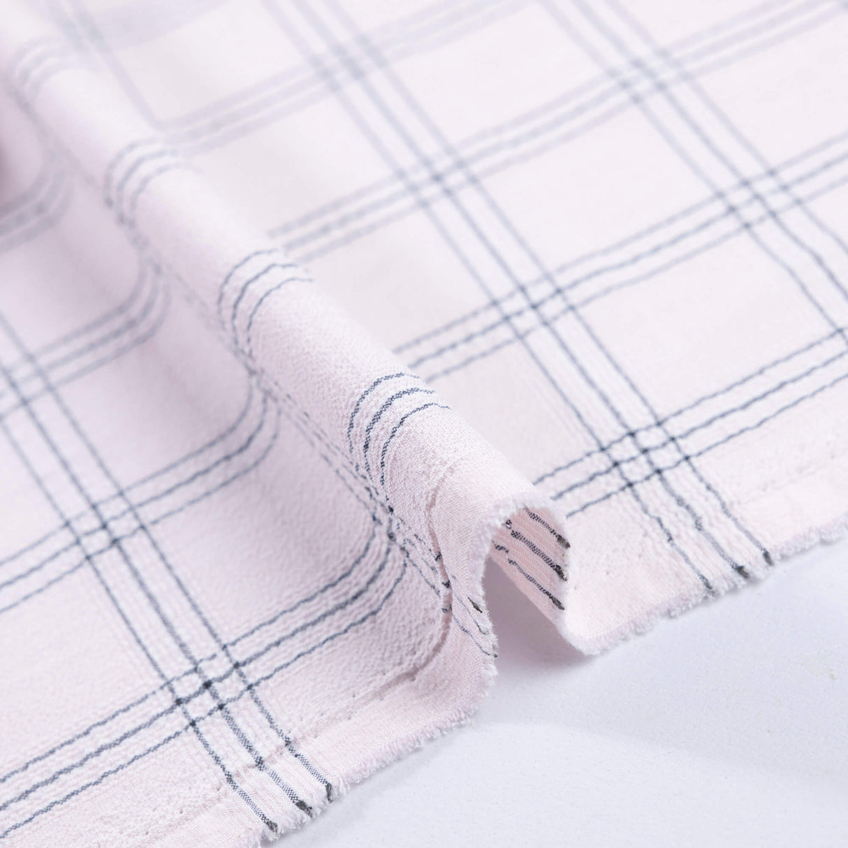 Crêpe gaufré bi-stretch - Carreaux rose poudré