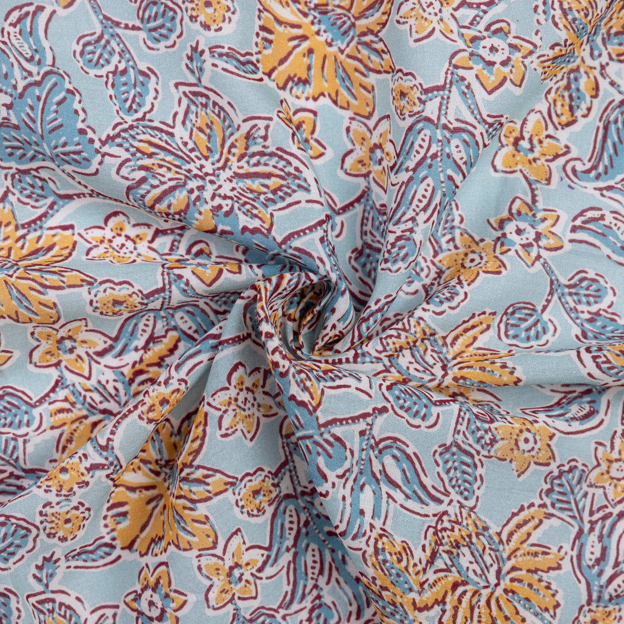 Voile 100% viscose – Fleurs jaunes fond bleu ciel