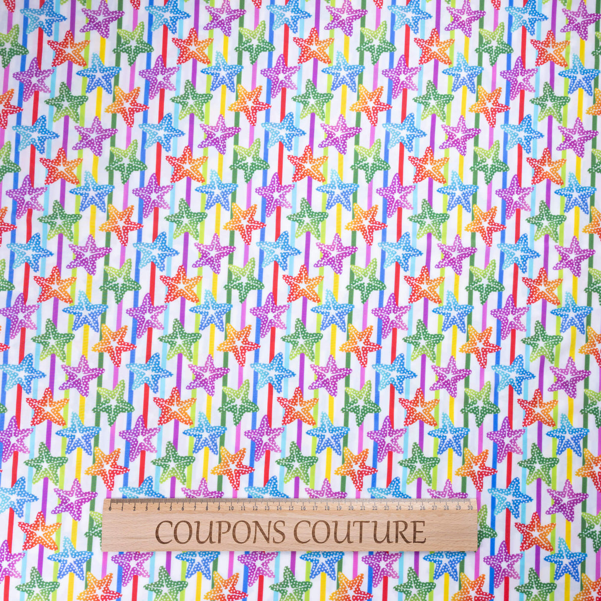 Tissu jersey maillot de bain - Étoiles de mer multicolores