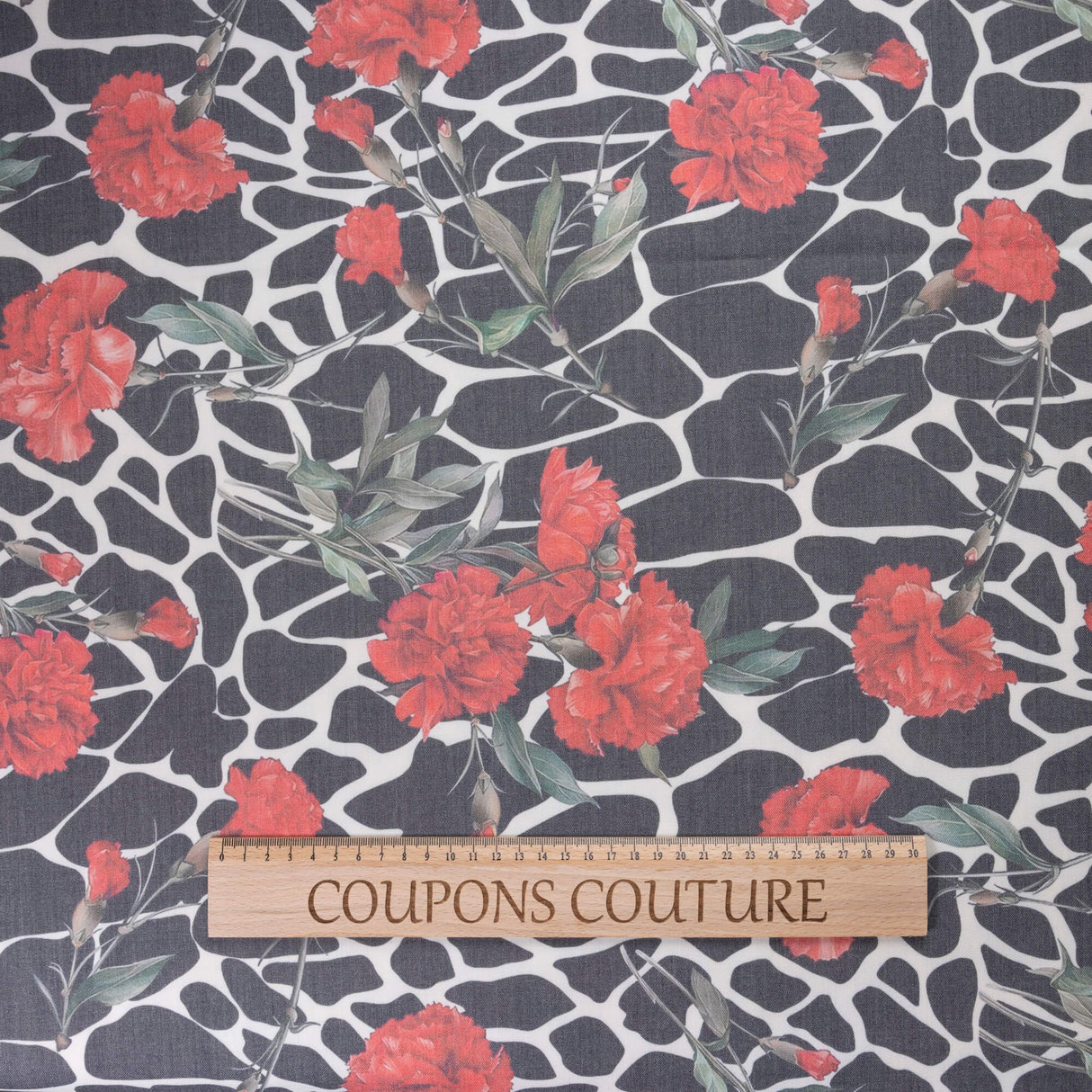 Gabardine de laine extensible - Œillets rouges et graphisme noir