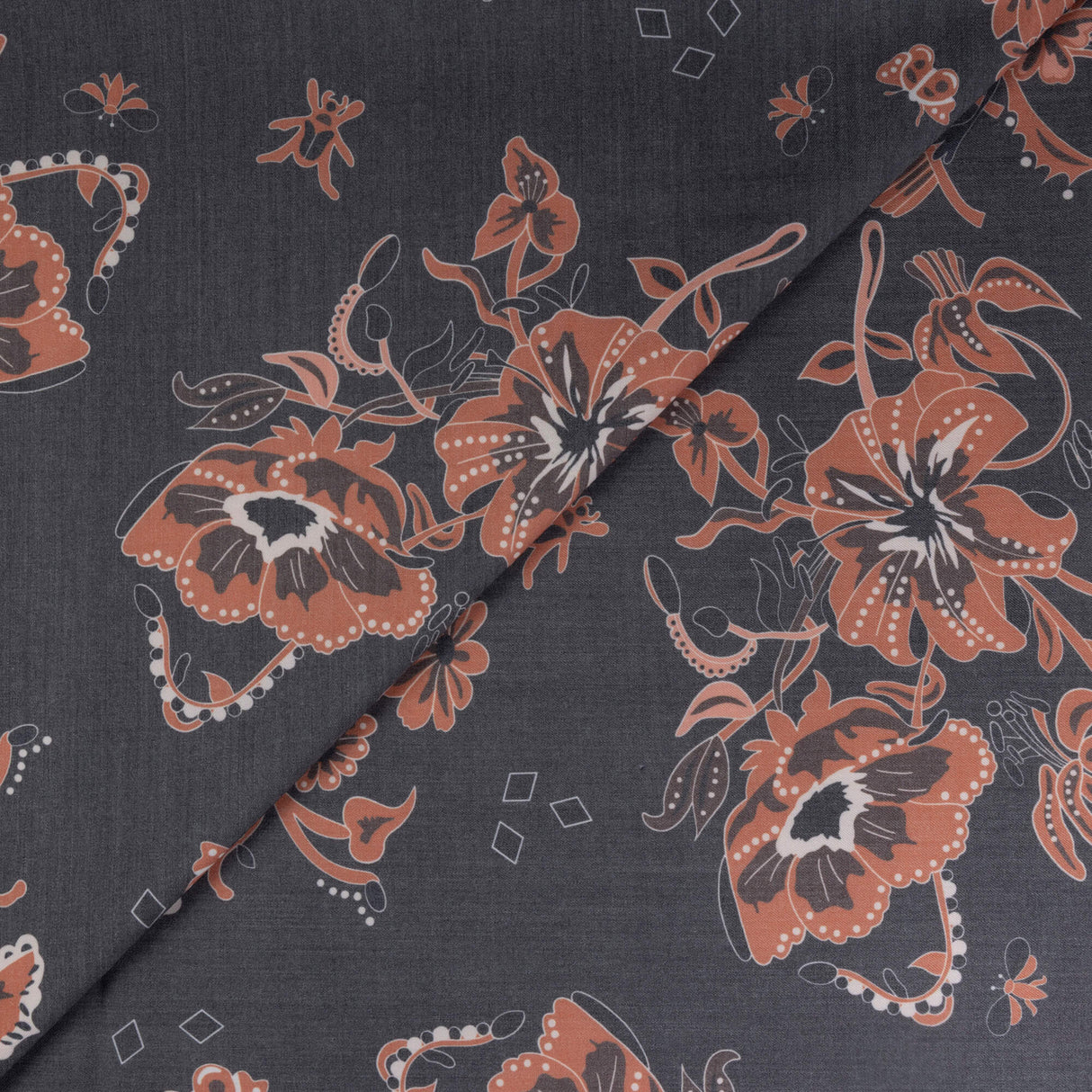 Gabardine de laine extensible - Fleurs terracotta sur fond noir