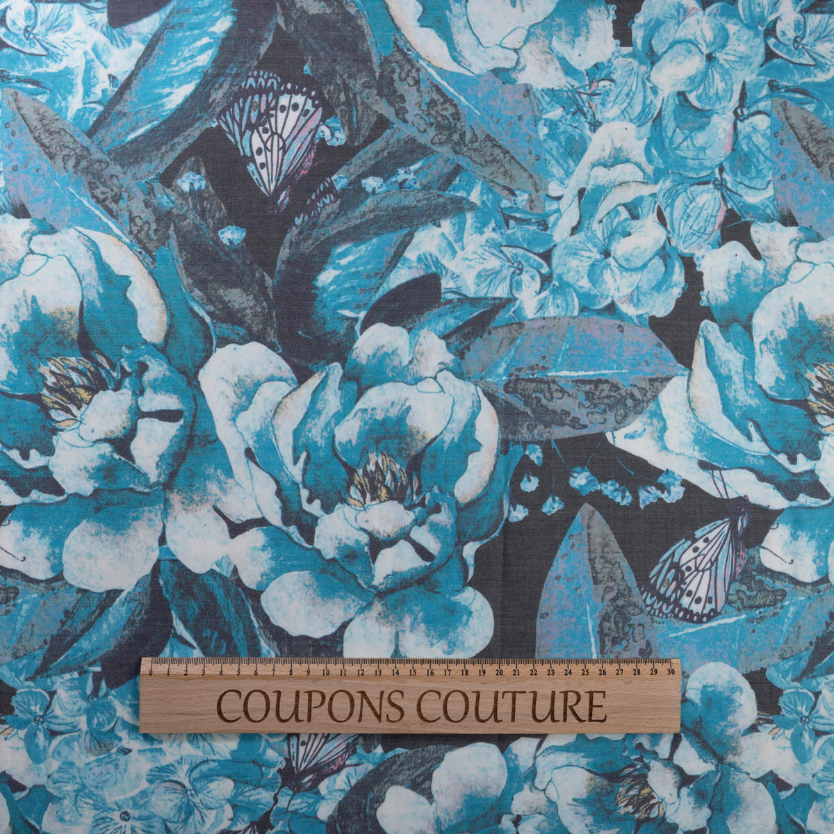 Gabardine de laine extensible - Fleurs et papillons bleu turquoise
