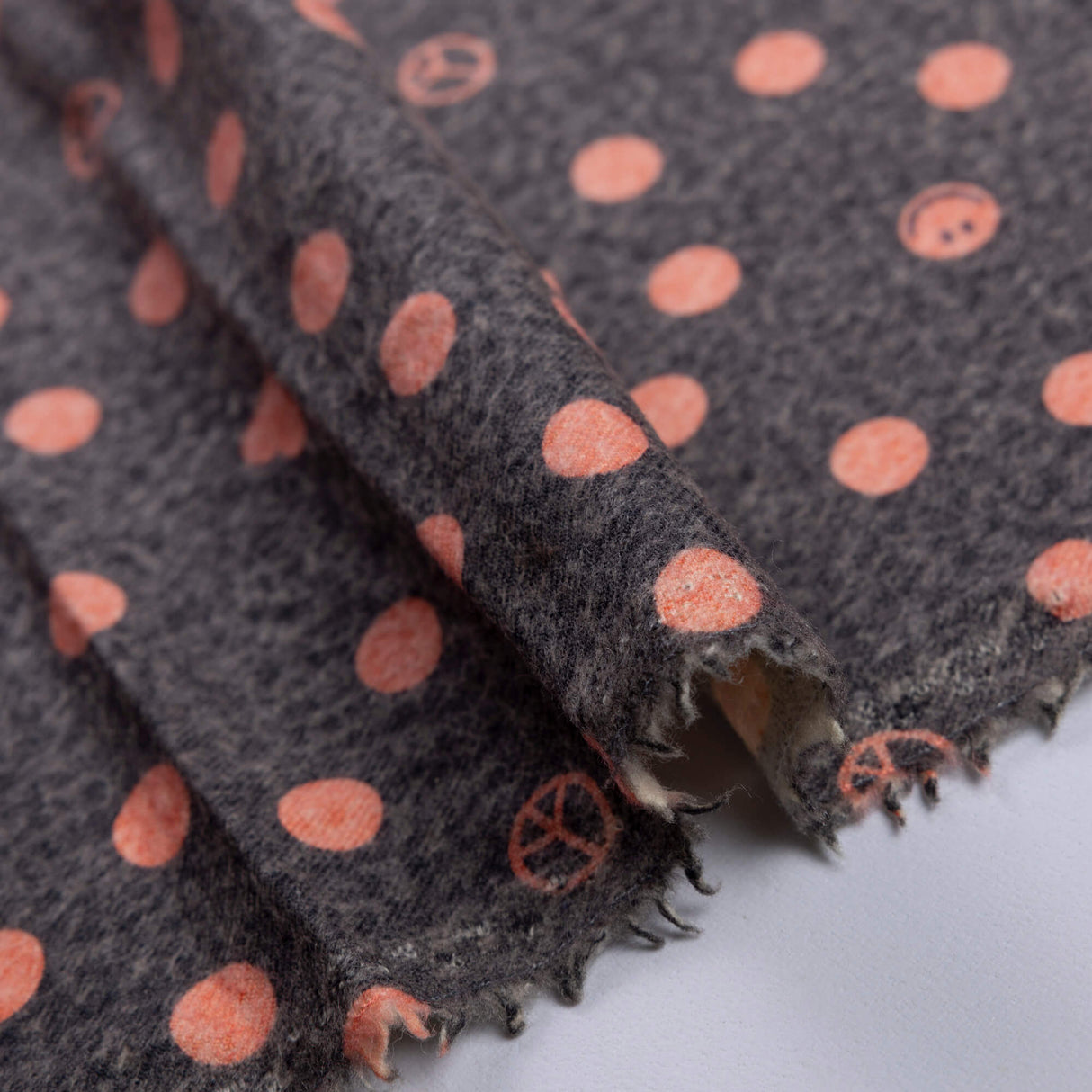 Flanelle 100% laine - Pois corail sur noir vieilli